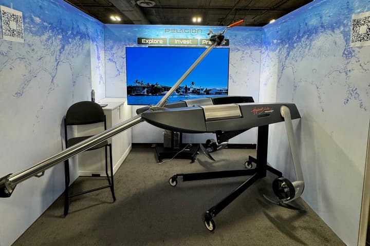 The production version of the HydroBlade e-foil (minus its proprietary front foil) presented on a wheeled stand at CES 2025