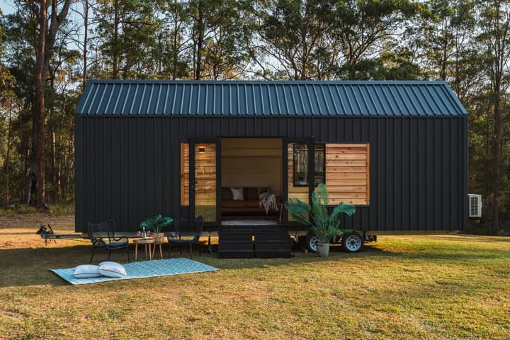 The Settler is a single-floor tiny house that boosts available floorspace with a slide-out section