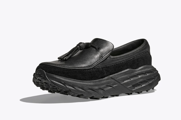 Worlds collide: Black leather loafer up to, alpine-ready trail runner below