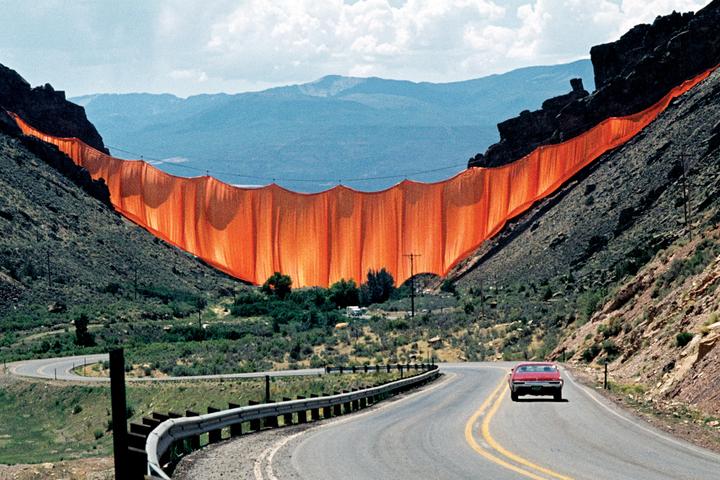 Valley Curtain in Rifle, Colorado, was completed in 1972. The artwork consisted of a 200,200-sq-ft (18,600-sq-m) orange curtain made from woven nylon fabric. It was installed between two Colorado mountain slopes but only stood for 28 hours as high winds made it necessary to remove it