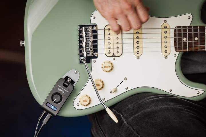 Sure, it's an ugly addition to a beautiful Strat – but the Mustang Micro Plus is the new state of the art in headphone practice amps