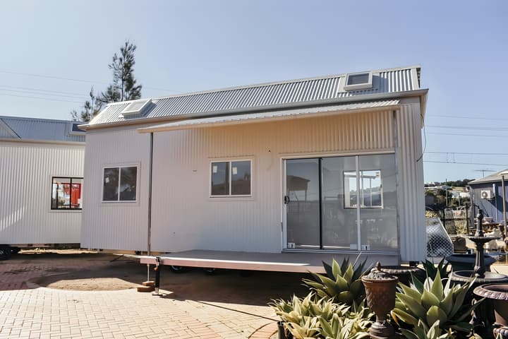 The Joely is a pint-sized tiny house with a space-saving layout that squeezes in three bedrooms